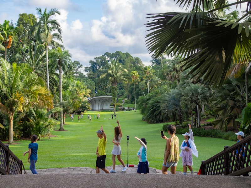 Singapore Botanic Gardens with manicured tropical lawn and palm trees